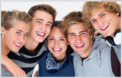 five smiling teenagers